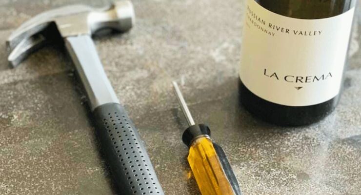 Open a wine bottle with a screwdriver